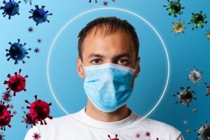 Concept de protection contre le virus Corona covid 19, symbole de protection des mains d'un médecin avec des icônes covid sur fond bleu, espace de copie et modèle de bannière web.